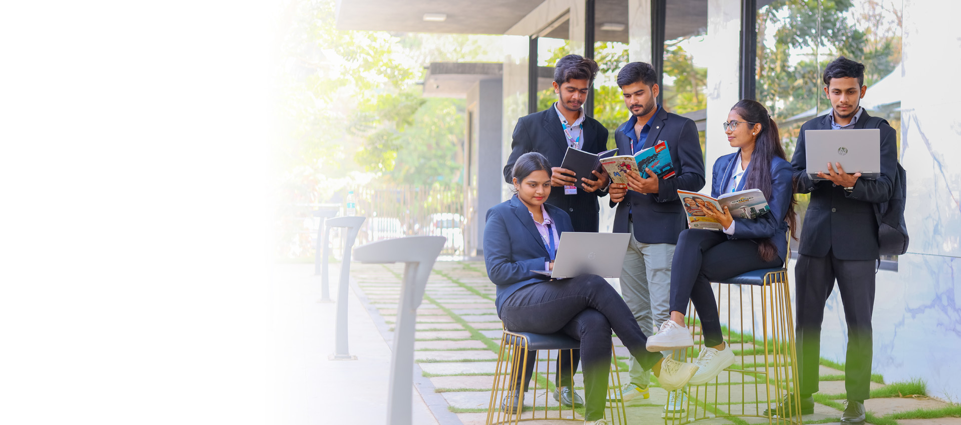 Students at Nalanda Degree College working together on the campus terrace